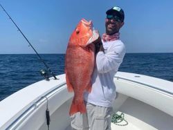 Fisherman holding a large fish in South Carolina