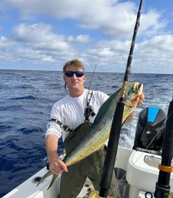 A person fishing in the scenic Mount Pleasant area