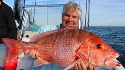 A lone fisherman in St. Augustine, holding a 29-inch catch.