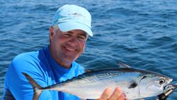 A fisherman with a little tunny fish caught in St. Augustine