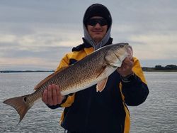 One fisherman catching a big fish on Johns Island