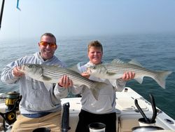 Two anglers fishing for striped bass in Osterville
