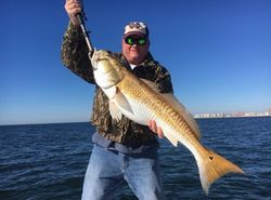 Lone angler fishing in Gulf Shores