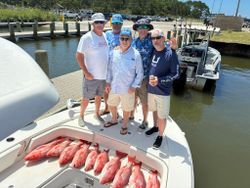 Red snapper fishing catch displayed on boat deck at Gulf Shores AL marina