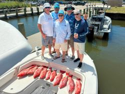 Red snapper fishing catch displayed on boat deck at Gulf Shores AL marina