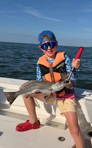 Speckled trout caught while fishing in Gulf Shores AL on boat deck