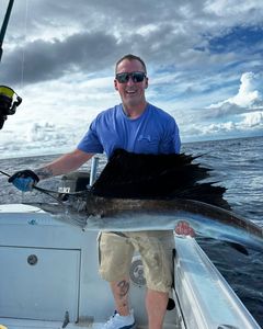 Angler with Atlantic Sailfish in Pompano Beach