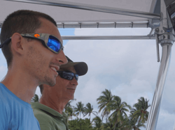 Two people enjoying a fishing cruise in FL