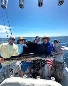 Angler with a large Atlantic Sailfish at Pompano Beach