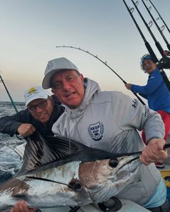 3 people enjoying a fishing cruise in Pompano Beach
