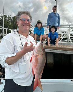 4 people fishing near Pompano Beach