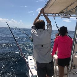 A person fishing from a boat in Pompano Beach