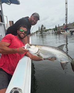 Angler with a large tarpon fish caught in Pompano Beach