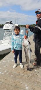 Angler holding a large black drum fish in Texas