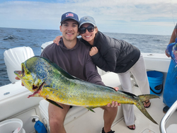 Two anglers on a boat in West Palm Beach, FL, fishing on a cruises and fishing adventure.