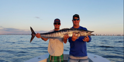 Two anglers fishing in FL on a cruises and fishing trip