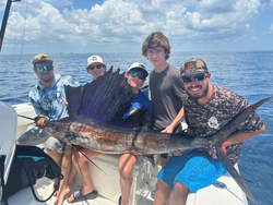 5 people on a cruise and fishing adventure in West Palm Beach