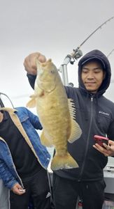 Bold bite! Smallmouth bass lifted on a cloudy day.