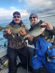 2 fishermen catching fish in MI