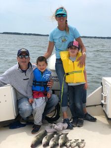 A group of 4 people enjoying a cruise or fishing trip in Salisbury