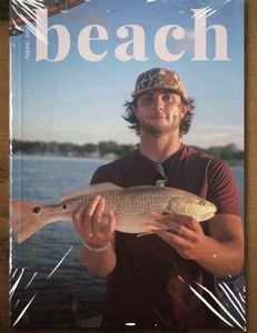 **Catch of the Day in Destin, Florida:** A proud angler displays a beautiful redfish caught during a scenic fishing trip with Reel Runners Charters.