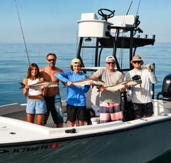 A group of 5 people fishing in Florida