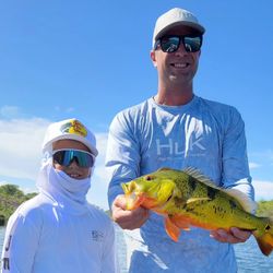 Two people enjoying a fishing tour in Florida