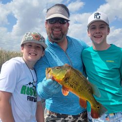 Three people enjoying a fishing tour in Fort Lauderdale