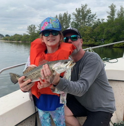 2 people fishing on the water in FL