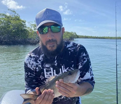 Photograph of a 7-inch grey snapper caught while fishing in FL.