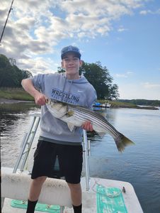 A person fishing for a striped bass in Melbourne