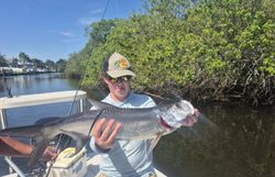 A person fishing for a tarpon in Florida