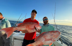 Two anglers with a 39-inch catch in Islamorada, Florida