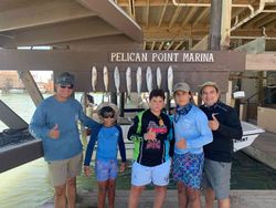 Group of 6 people fishing in Port Isabel