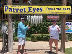 A group of 4 people fishing at Port Isabel