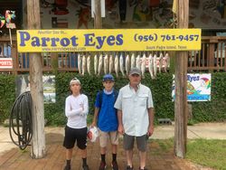 Group of 7 people fishing in Port Isabel