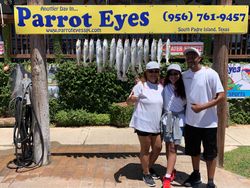 A group of 6 people fishing at Port Isabel