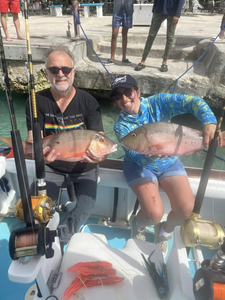 Two fishermen with a catch of two fish in Dominicus