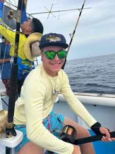Two people fishing in Dominicus