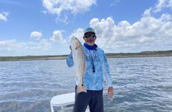 One fisherman catching a 22-inch fish in Corpus Christi