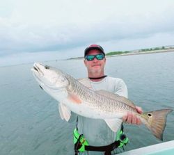 Angler catching a 31-inch fish in TX