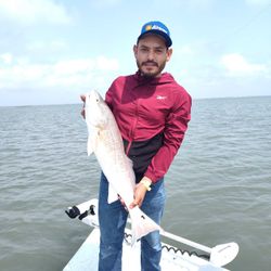 Proud Redfish catch on a calm Texas bay!