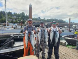 5 colorful salmon fish caught by 4 people in Astoria