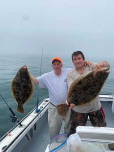 Two Summer Flounder fish caught in MA