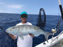 Fisherman reeling in catch in Kailua-Kona
