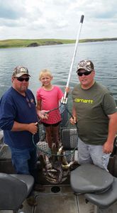 Three anglers enjoying a fishing trip in SD