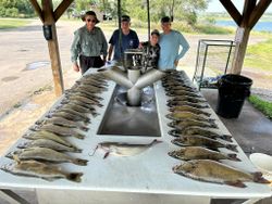 4 people with 5 big fish caught while fishing in Pierre