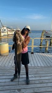 Angler with fishing rod, catching one fish in FL