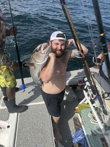 Fisherman holding a 15-inch fish in FL