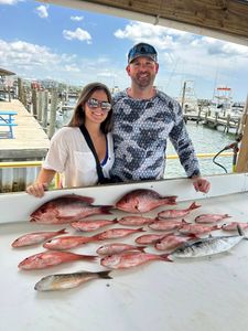 Two people fishing in Florida with 6 fish caught